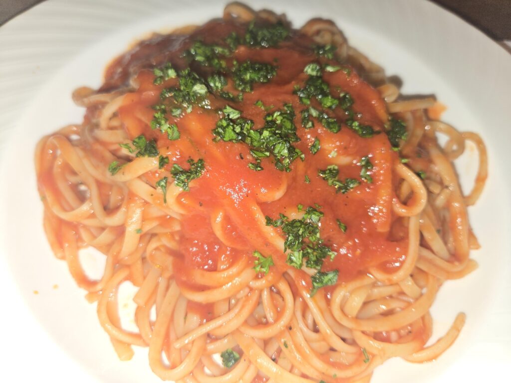 Linguine al Pomodoro (topped w/ basil and parsley)