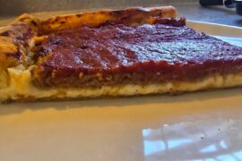 Thin crust Lou Malnati's style sausage with cheese stuffed crust.