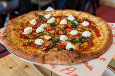 Sausage, rapini, cherry peppers, lemon ricotta. From my local pizza place.