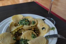 Corzetti pasta with pistachio pesto and basil pesto.