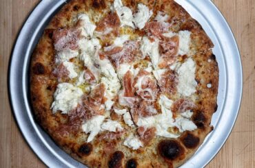 Prosciutto, burrata and garlic cream, topped with Parmigiano Reggiano