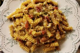 Fusilli with broccoli florets, cherry tomatoes, salsiccia, garlic, white wine, chilli flakes and salted anchovies