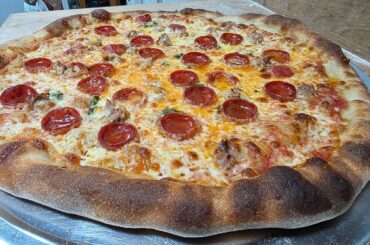 BBQ chicken Pizza and a sausage, basil and pepperoni.