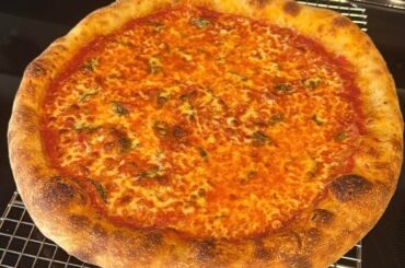 Plain cheese and a Prosciutto, arugula, and Burrata pie. Home oven with a pizza steel