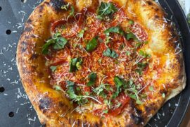 Pepperoni, Calabrian chili, basil, microgreens, pecorino romano, and hot honey - and lemon zest