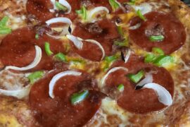 Homemade pizza, baked on a pizza stone.