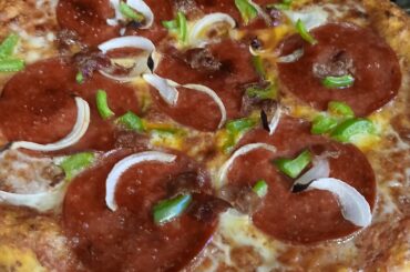 Homemade pizza, baked on a pizza stone.