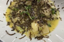 Ricotta and hazelnut ravioli with grated fresh truffles and sage butter emulsion.