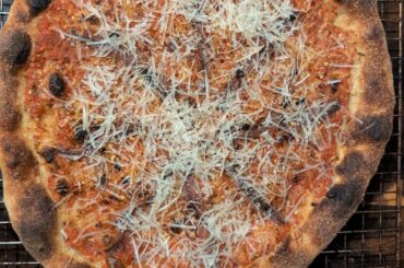 Anchovies + lots of parm and sauce