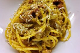 Spaghettoni with artichoke, sausage, saffron and pecorino