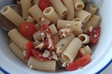 Homemade pasta with tomato and feta cheese