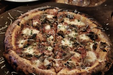 Onions, Mushroom, Chilli Flakes, Mozzarella, Fresh Basil, Shaved Parmigiano Reggiano Cheese pizza