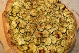 Zucchini Pizza on the barbecue with a pizza stone