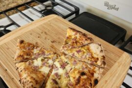 Brunch Neapolitan: Egg white base with oregano, pecorino romano & turkey bacon, then finished with chili crunch, garlic oil & chives