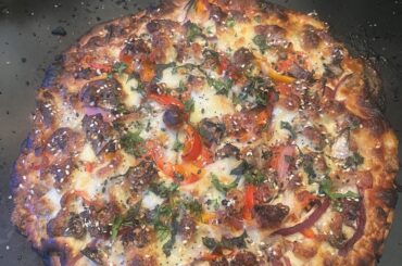 Bacon, sausage, and pepperoni with red onions, bell peppers, and mushrooms, Fresh sliced mozzarella @ 500 degrees for 19min. Finished with fresh chopped basil and cilantro and a sprinkle of everything seasoning. How’d I do?