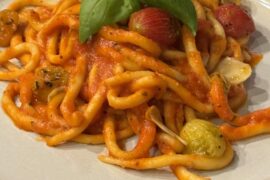 Pici w/ green garlic pomodoro and confit tomatoes