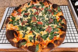 Spinach, feta, and tomatoes. Baked on a steel.