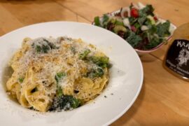 Fettuccine Alfredo with garlic chili crisp sautéed broccoli florets