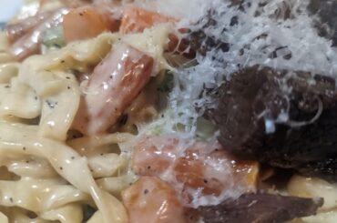 Brown butter thyme cream sauce with carrots, zucchini and short rib