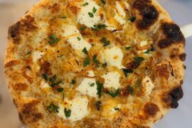 White pie - Ricotta, Mozz, Caramelized Onions, Sesame Seeds, Parm, EVOO, Parsley