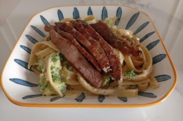 Broccoli Alfredo Fettuccine with a steak on top