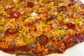 Homemade sausage, pepperoni, onion, and pepperoncini