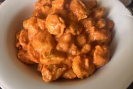 Tortellini with cream, pancetta and tomato sauce