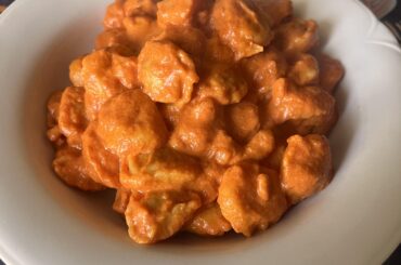 Tortellini with cream, pancetta and tomato sauce