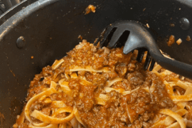 Fettuccine with beef wagyu sauce, sour dough bread, and a little red wine!