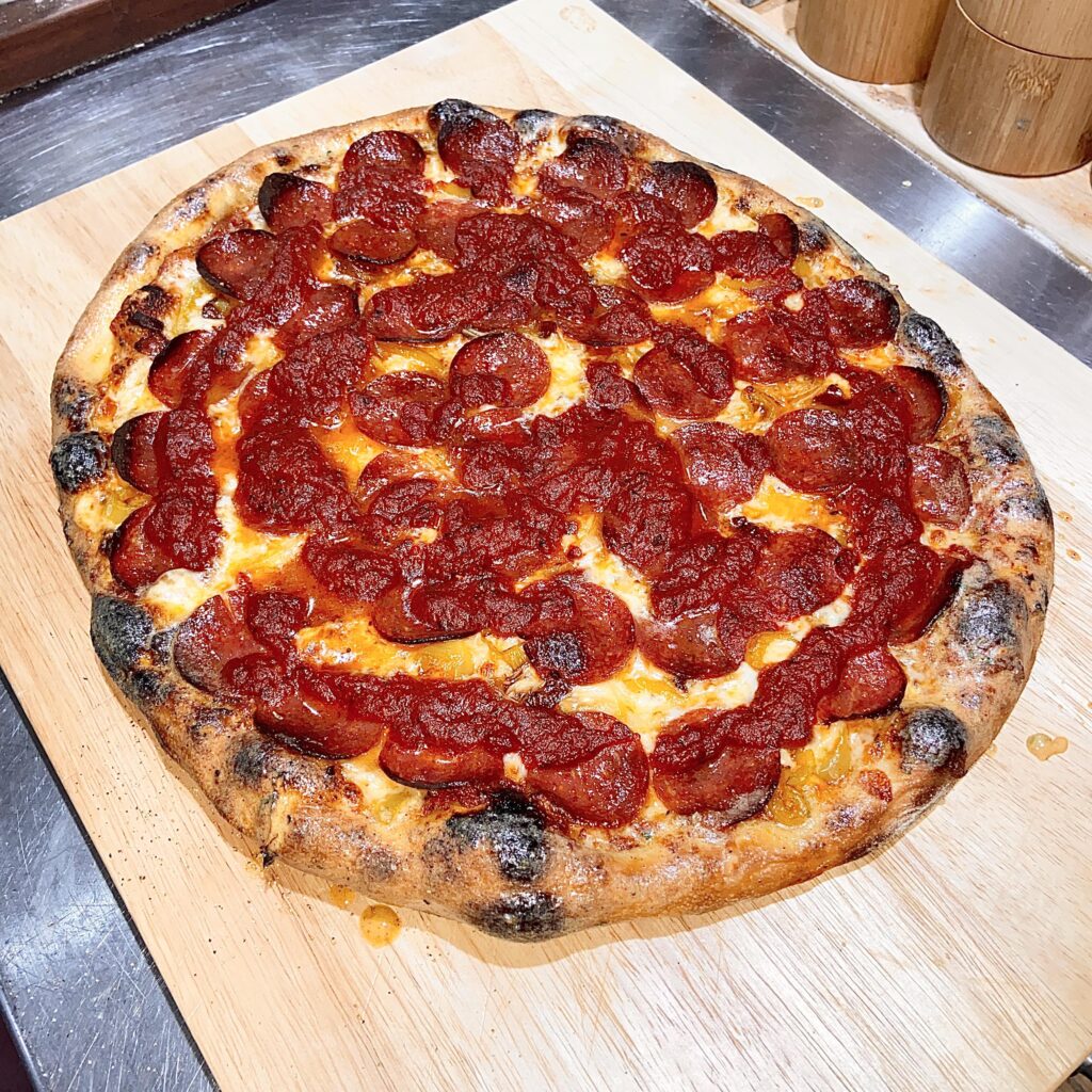 Pepperoni, bacon, onions and banana peppers.