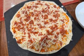 Thin crust same day dough on a pizza steel