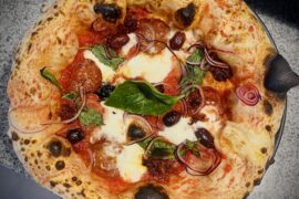 How’s my Neapolitan Calabria? Looking for honest feedback on crust structure, char, and topping balance.