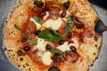 How’s my Neapolitan Calabria? Looking for honest feedback on crust structure, char, and topping balance.