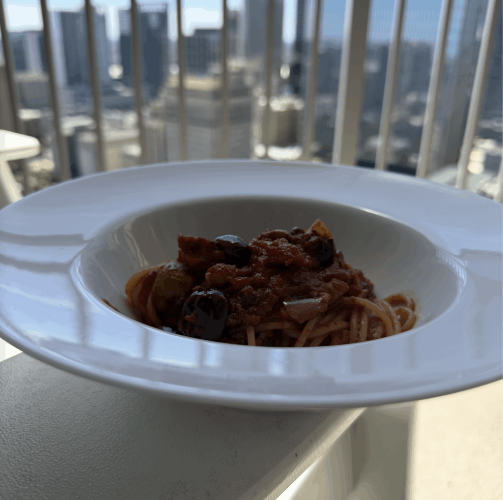 Spaghetti Puttanesca.  Green and black olives, garlic, onion, capers ,anchovies (chunky)