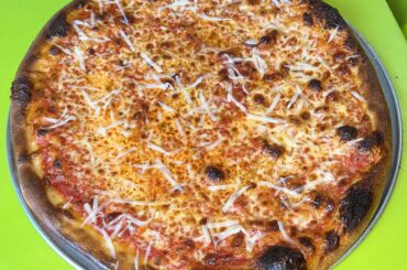 Tonight I made a 16” plain NY style pizza in my apartment oven, hit with a heavy amount of grated parm after bake.