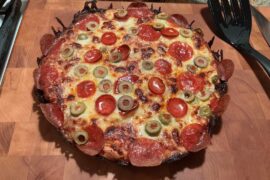 Pan pizza with two kinds of pep and sliced green pimento stuffed olives.