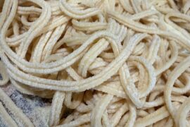 Why are my pasta noodles sticking together in pairs?