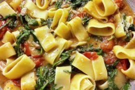 Calamarata with canned tuna, cherry tomatoes, garlic, salted anchovies, arugula, dried chillies, lemon juice, cracked black pepper and olive oil