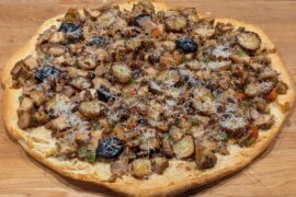 Roasted chicken, potato and vegetable pizza on croisant crust