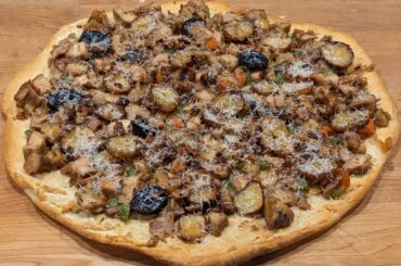 Roasted chicken, potato and vegetable pizza on croisant crust