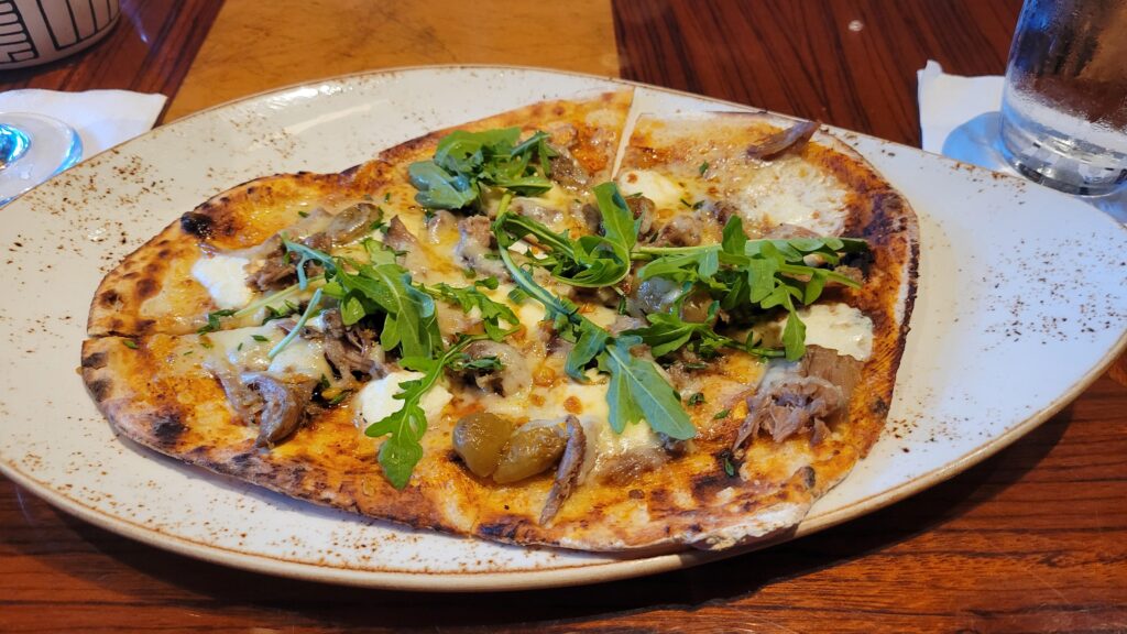 Duck confit and honey-raisin flatbread
