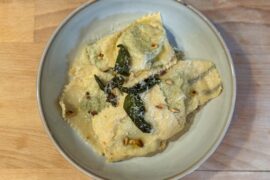 Spinach & Ricotta Ravioli with a Sage Lemon Butter & Toasted Pine Nuts. The pasta is laminated with sage leaves too