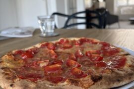 Simple pizza with tomatoes and parmezan