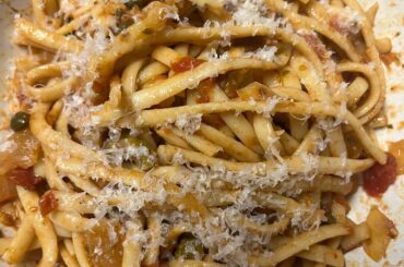 Simple dinner tonight- pasta puttanesca with sourdough bread and homemade red wine shallot compound butter