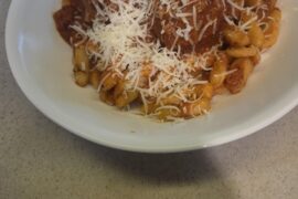 Home made Cavatelli, sauce and meatballs.