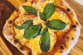 Margherita. Weber grill with a pizza steel, cherry wood smoked. Best pizza I've ever made.