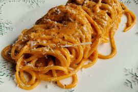 Spaghetti with speck, salsiccia, white wine, tomato paste, egg yolk, grana padano, cracked black pepper and fresh cream