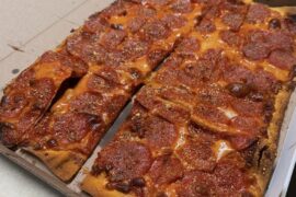 St Louis style pizza using thin crust and provel cheese