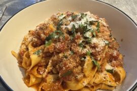 Sausage, chilli and roasted peppers ragu with pepardelle