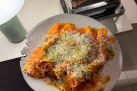 homemade BIGGG farfalle, tomato butter sauce with calabrian chili, parsley-panko and parm